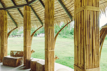 Many bamboo bindings are tied together with hemp ropes to be used as pole for resting cottage. Selective focus on hemp ropes.