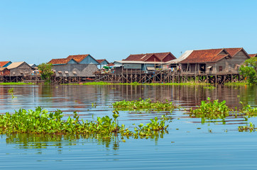 The colorful stilt houses in the floating village of Kompong Khleang by the Tonle Sap lake, Siem...