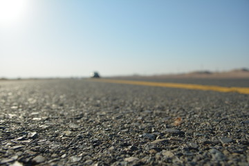 close up of asphalt road in desert