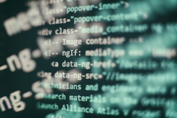 Programmer workplace. Big data storage and cloud computing representation. Programming code. Website development. Web site codes on computer monitor. Abstract screen of software. Computer script.