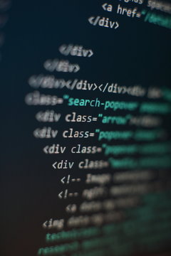 Programmer workplace. Big data storage and cloud computing representation. Programming code. Website development. Web site codes on computer monitor. Abstract screen of software. Computer script.