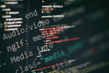 Programmer workplace. Big data storage and cloud computing representation. Programming code. Website development. Web site codes on computer monitor. Abstract screen of software. Computer script.