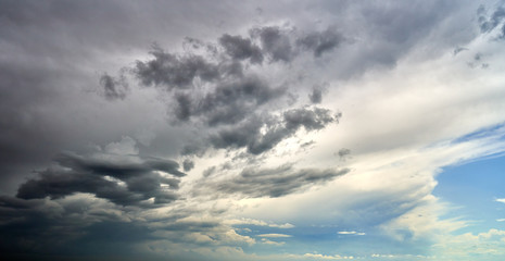 Fototapeta premium white thunderclouds floating across the sky