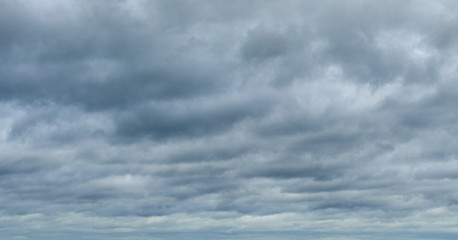 white thunderclouds floating across the sky
