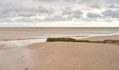 white thunderclouds floating over the sea