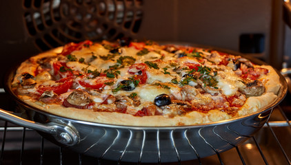 pizza cooked in the oven in the kitchen