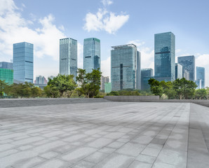 Panoramic skyline and buildings with empty square floor.