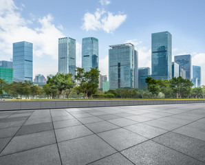 Panoramic skyline and buildings with empty square floor.