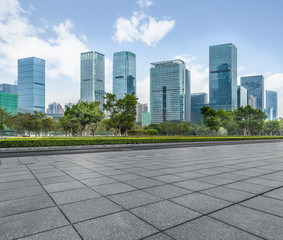 Panoramic skyline and buildings with empty square floor.