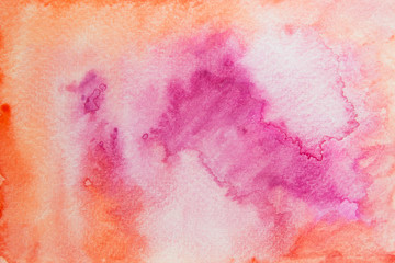 Hand painting pink and orange watercolor on paper background.