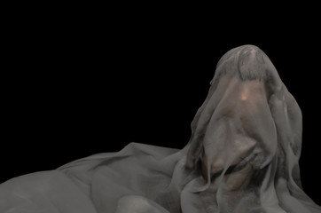 Long black hair doll cover with white sheet drown in water on dark background. Minimal Halloween scary concept.