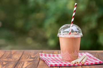 milkshake in disposable plastic cup