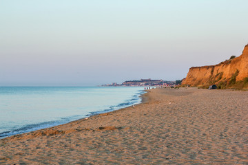 dawn on the beach of the Black Sea in orange tones