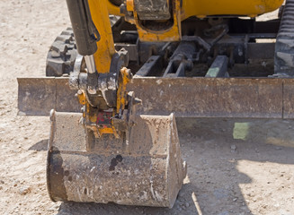 yellow excavator machines
