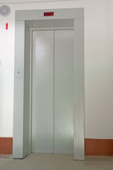 Elevator door in entrance hall of an apartment building