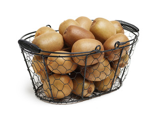 Whole and cut golden kiwifruit/ kiwi (Actinidia chinensis) on white 