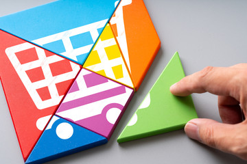 Online shopping icon on colorful puzzle