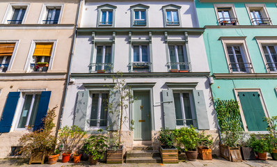 Fototapeta na wymiar Cremieux Street (Rue Cremieux), Paris, France. Rue Cremieux in the 12th Arrondissement is one of the prettiest residential streets in Paris. Colored houses in Rue Cremieux street in Paris. France.