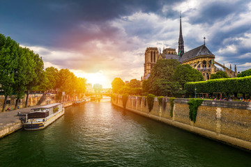 Notre Dame de Paris cathedral, France. Notre Dame de Paris Cathedral, most beautiful Cathedral in Paris. Picturesque sunset over Cathedral of Notre Dame de Paris, destroyed in a fire in 2019, Paris. - obrazy, fototapety, plakaty
