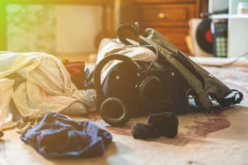 mess of many things and clothes on the floor at home before the journey start