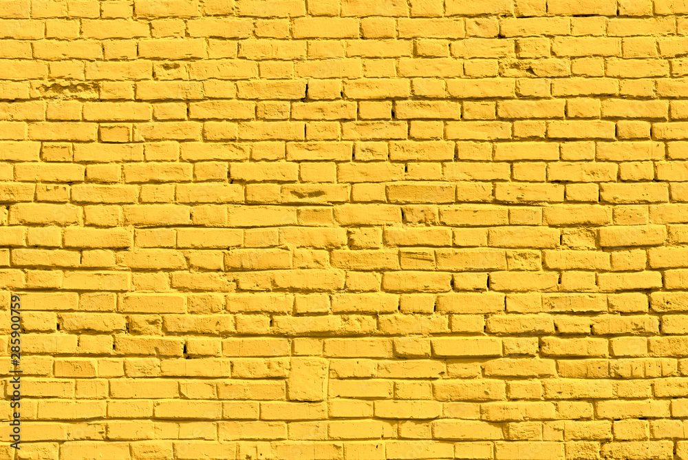 Wall mural yellow brick wall, copy space, brick texture, background