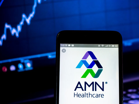 Kiev, Ukraine, February 17, 2019, illustrative editorial.. AMN HEALTHCARE SERVICES INC logo seen displayed on smart phone