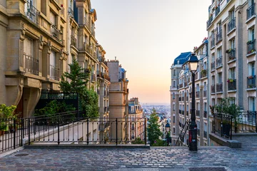  Montmartre district of Paris. Morning Montmartre staircase in Paris, France. Europa. View of cozy street in quarter Montmartre in Paris, France. Architecture and landmarks of Paris. Postcard of Paris. © daliu