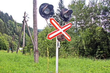 Railways and fencing signal signs at level crossings.