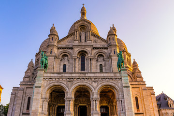 Basilica Sacre Coeur in Montmartre in Paris, France. The Basilica of the Sacred Heart (Sacre Coeur Basilica). Montmartre, Paris, France. Paris. Basilica Sacre-Coeur. On the hill Montmartre. Paris.