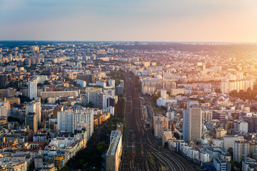 Top view of Paris skyline from above. Main landmarks of european megapolis with train station of Vaugirard-Belt. Bird-eye view from observation deck of Montparnasse tower. Paris, France