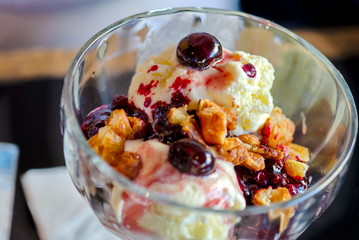 ice cream with pieces of belgian waffles and forest berries
