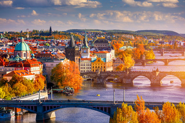Fototapeta Autumn view to Charles bridge on Vltava river in Prague, Czech Republic. Autumn view to Charles Bridge, Prague old town and Vltava river from popular view point in the Letna park (Letenske sady). obraz