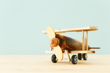 vintage toy plane over wooden table