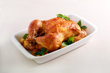 Roast whole chicken with potatoes