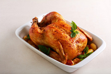 Roast whole chicken with potatoes