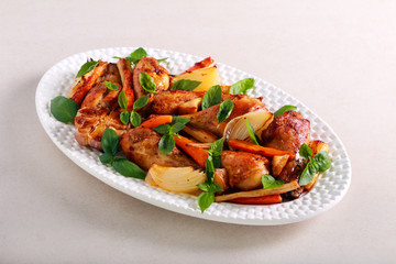 Roast chicken drumsticks with vegetables