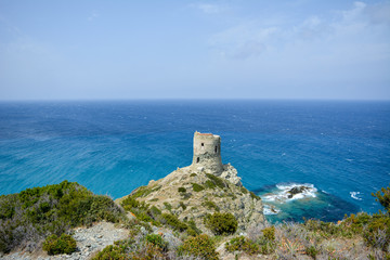 Fototapeta na wymiar The Tower of Agnellu, a Genoese tower located in the commune of Rogliano (Haute-Corse). Sentier des douaniers. Corsica, France