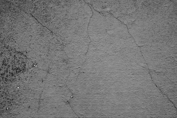 Obraz premium Texture of a concrete wall with cracks and scratches which can be used as a background