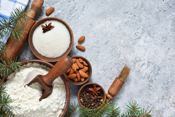 Christmas baking. Baking ingredients: flour, sugar, nuts, cinnamon, spices. Top view.