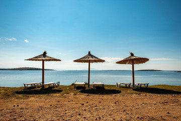 Beach umbrella at the sea in Premantura
