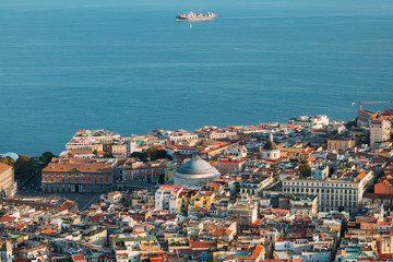 Naples, Italy. Top View Cityscape Skyline With Famous Landmarks And Part Of Gulf Of Naples With Ship In Sunny Day. Many Old Churches And Temples