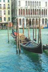 Nice black gondola boat on Grand canal in Venice