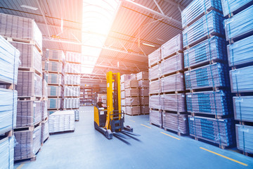Forklift loader in storage warehouse ship yard. Distribution products. Delivery. Logistics....
