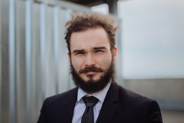 Portrait of a young man dressed in business suit