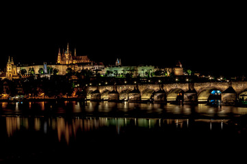 Obraz premium Beautiful night view of Hradcany. Classic panoramic view of Charles Bridge and Prague castle over Vltava river. Prague, Czech Republic