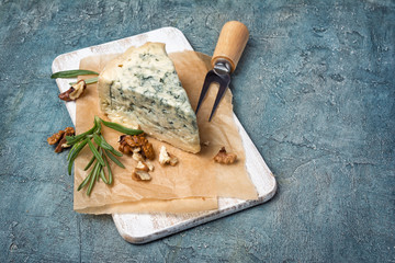 Soft blue cheese with rosemary and nuts