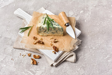 Fototapeta na wymiar Soft blue cheese with rosemary and garlic