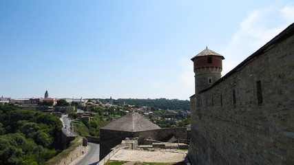 Fototapeta na wymiar view of the city from the Kamianets-Podilskyi Castle (is a former Ruthenian-Lithuanian castle and a later three-part Polish fortress located in the city of Kamianets-Podilskyi, Ukraine. 07.08.2019