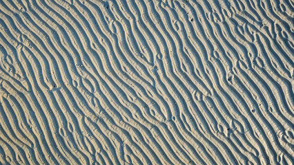 Stripe pattern sand on the beach