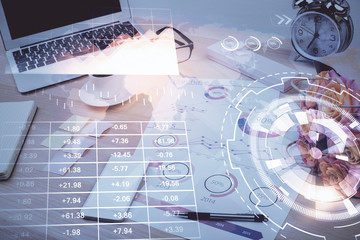 Stock market graph and table with computer background. Multi exposure. Concept of financial analysis.